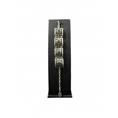 Bohemian style bracelet with vintage curved square shapes with green solitaires 