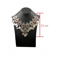 Bohemian style silver color necklace with vintage shapes and coin tassels with red solitaires 