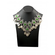 Bohemian style silver color necklace with vintage shapes and coin tassels with green solitaires 